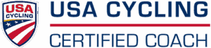 USA Cycling Certified Coach logo with a shield featuring red, white, and blue stripes and stars, and bold text stating USA Cycling Certified Coach beside it.