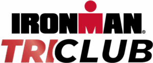 IRONMAN TRI CLUB logo with “IRONMAN” in bold black letters, the “M” featuring a red dot above it, and “TRI CLUB” below, with “TRI” in red and “CLUB” in black.