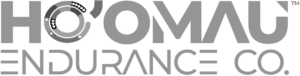 The non-standard horizontal version of the Ho'Omau Endurance Co. logo in grayscale with a TM trademark symbol in PNG format and 1000x253 size.