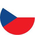 A circular flag icon of the Czech Republic, featuring a blue triangle on the left, with white on the top right and red on the bottom right.