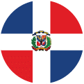 A circular flag image of the Dominican Republic, featuring a white cross dividing blue and red quarters, with the national coat of arms in the center.