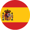 A circular flag image of Spain, featuring three horizontal stripes—red on the top and bottom, yellow in the center—and Spain’s coat of arms on the left side of the yellow stripe.