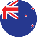A circular flag icon of New Zealand, featuring the Union Jack in the top left corner and four red stars with white borders on a blue background.